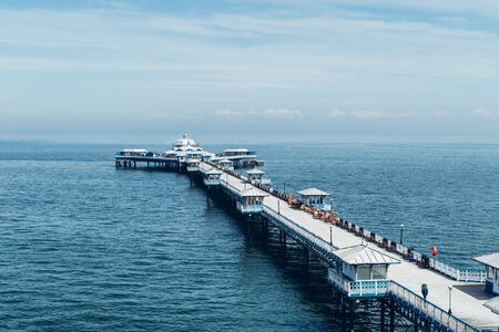 Beautiful Summer Day in Llandudno Sea Front and empty Pier in North Wales, United Kingdomの写真素材