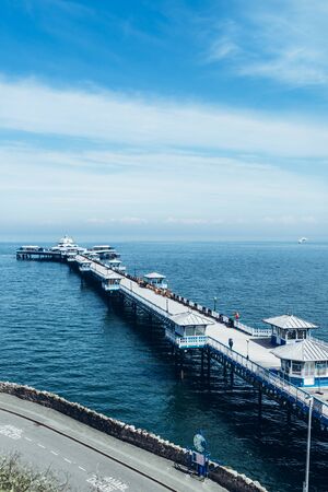 Beautiful Summer Day in Llandudno Sea Front and empty Pier in North Wales, United Kingdomの写真素材