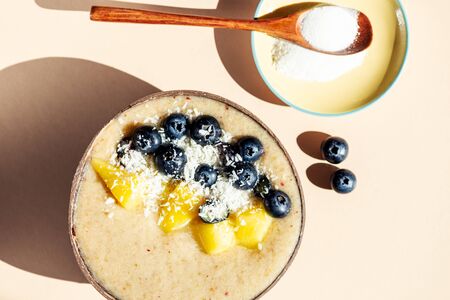 Collagen Powder and Healthy Smoothie from Banana, Pineapple and gluten free oats in the Coconut...