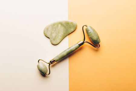 Jade face roller and Gua sha stone for beauty facial massage therapyの写真素材
