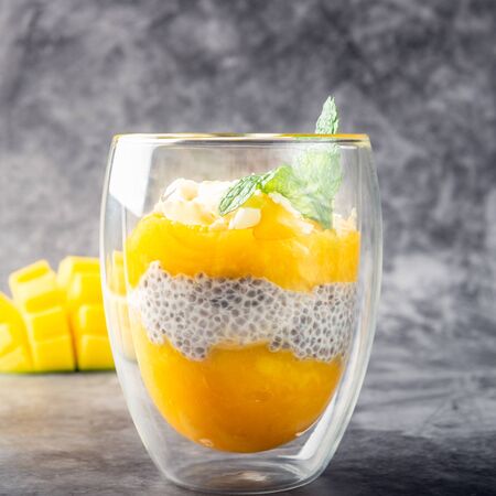 Homemade 4 Ingredient Mango Chia Pudding made with Almond or Coconut Milk in the Double Wall Glass Cupsの写真素材
