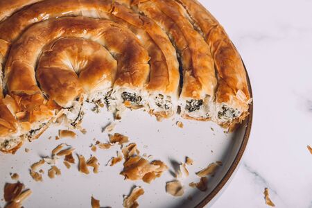 Filo Spinach and Feta Twist Pie in the plate freashly baked at homeの写真素材