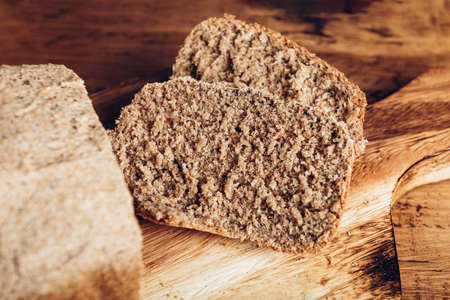Sliced Homemade wholemeal bread. Easy Cooking of healthy bread from alternative floursの写真素材