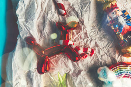 Box of Unusual Modern Christmas Baubles such as ice cream, rainbow, cat, balloon dog, pineapple, candy cane, nutcrackerの写真素材