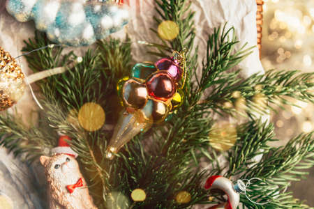 Box of Unusual Modern Christmas Baubles such as ice cream, rainbow, cat, balloon dog, pineapple, candy cane, nutcrackerの写真素材