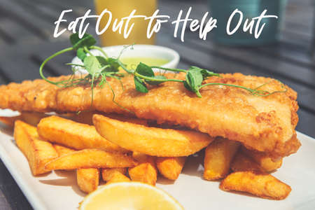 Eat Out to Help Out phrase. Traditional English Food such as Fish and Chips with green mushy peas served in the Pub or Restaurantの写真素材