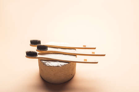 A family set of wooden bamboo toothbrushes. Save the planet or no plastic concept. Top view, flatlay, copy spaceの写真素材