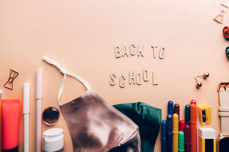 Back to school wooden letters. Preparation for going back to school with usual stationery and new...