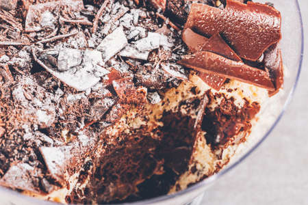 Family Pot of Irresistible Layered Billionaires Dessert made from chocolate and caramel mousse layers, chocolate brownie bites and crunchy chocolate honeycomb pieces. Finished with choco chunksの写真素材