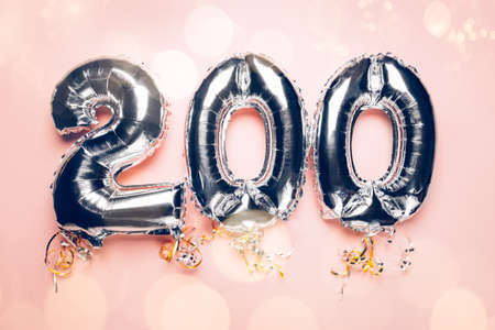 Balloon Bunting 200 made from Silver Number Balloons on pink background. Holiday Party Decoration or postcard conceptの写真素材