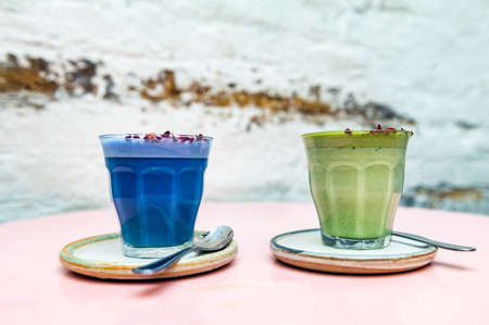 Glasses of Super Lattes such as Butterfly Matcha from organic blue matcha and nut milk, Rose Matcha...