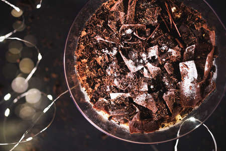 Xmas dessert. Family Pot of Irresistible Layered Billionaires Dessert made from chocolate and caramel mousse layers, chocolate brownie bites and crunchy chocolate honeycomb pieces.の写真素材