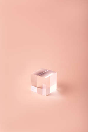 Acrylic Solid Display Block for Shop Windows on pink background, empty podium for product presentation, geometric stand for cosmeticsの写真素材