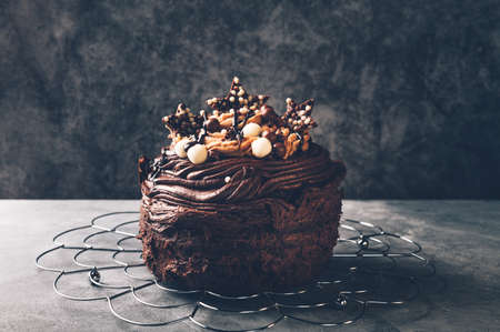 Tiny triple chocolate cake decorated with chocolate frostingの写真素材