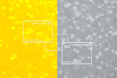 Abstract light, illuminating yellow and gray bokeh pattern in heart shape. St Valentines Day or Holiday concept, background image, colors of the year 2021の写真素材