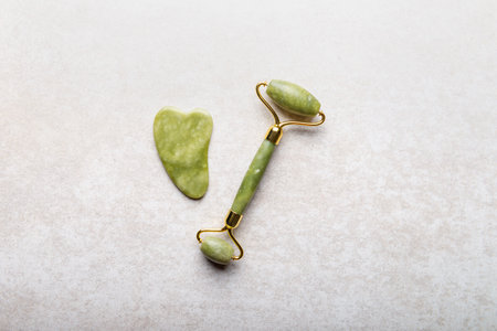 Two types of Jade face roller and Gua sha stone for beauty facial massage therapy, Skin Care Anti-Aging Toolの写真素材