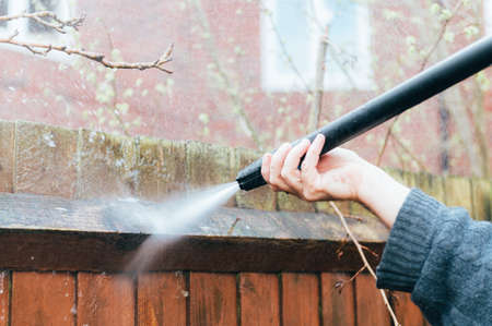Cleaning of Wood Fence with pressure washerの写真素材