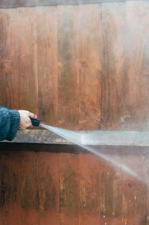 Cleaning of Wood Fence with pressure washerの写真素材