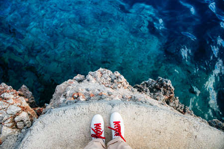 Azure waters on Palma and tourist feetの写真素材