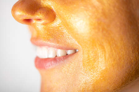 Trendy Gold face mask on womans faceの写真素材
