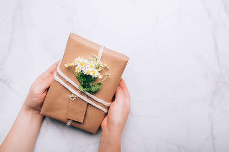 Eco friendly gift wrapped in brown paperの写真素材