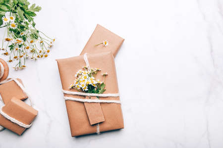 Eco friendly gift wrapped in brown paperの写真素材