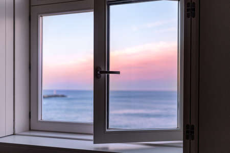 Sunrise over Atlantic Ocean through the open window