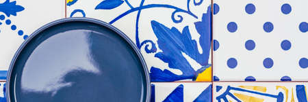 Plate on tile backgroundの写真素材