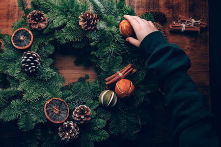 Process of making christmas wreathの写真素材
