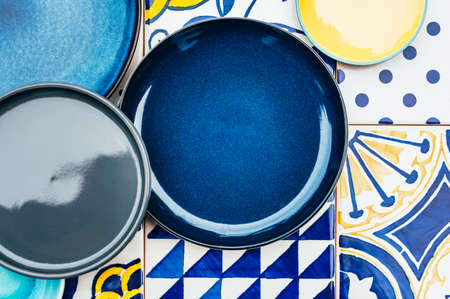 Plates on tile backgroundの写真素材