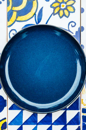 Plate on tile backgroundの写真素材