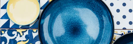 Plates on tile backgroundの写真素材