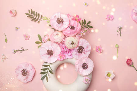 Tender ranunculus flowers in ceramic vaseの写真素材