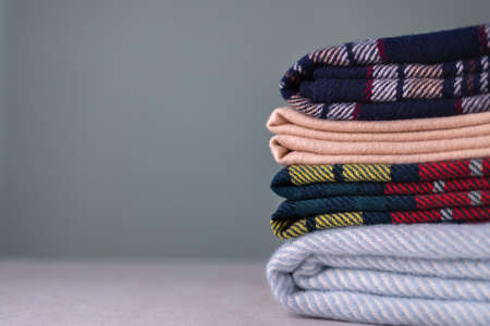 Stack of woolen checked blanketsの写真素材