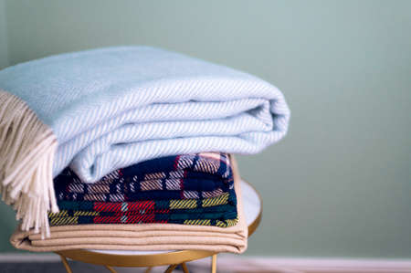 Stack of woolen checked blanketsの写真素材