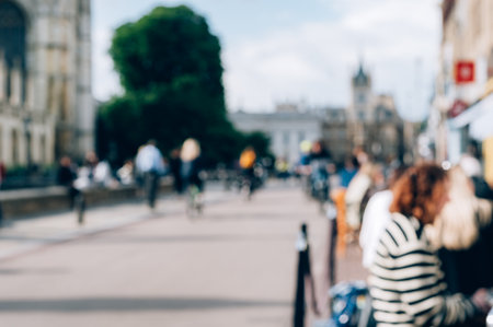 Cambridge, Cambridgeshire, United Kingdom - 01 June, 2022: Blurred photo of city centre near Kings College with cafes, shops, students and tourists on backgroundのeditorial素材