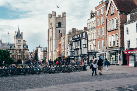 Cambridge, Cambridgeshire, United Kingdom - 01 June, 2022: Entrance to Kings College with cafes, shops, students, bikes and tourists on backgroundのeditorial素材