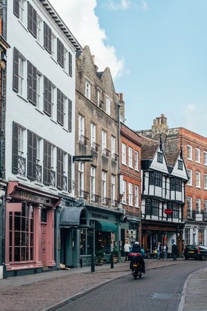 Cambridge, Cambridgeshire, United Kingdom - 01 June, 2022: City centre streets near Johns College, bikes, cafe, shops, students and torists walkingのeditorial素材