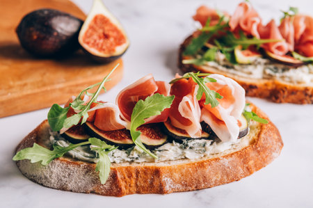 Open Sandwich with Blue Cheese, Figs, Rocket salad leaves and Prosciuttoの写真素材
