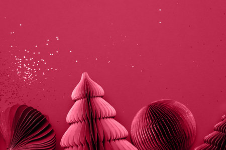 Trendy decorative paper Christmas tree baubles, DIY project, Organic Modern Design, Festive Honeycomb Foldable 3D balls, plastic free. Image toned in viva magenta, color of the year 2023の写真素材