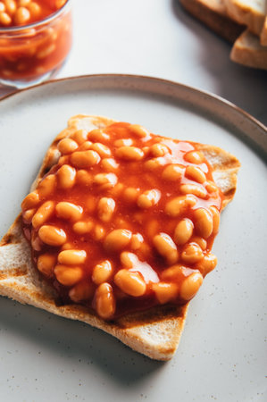 Baked Beans in Tomato Sauce on Slice of Toasted Bread, traditional British breakfastの写真素材
