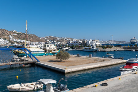 Mykonos, Greece: July 11, 2022: Mykonos ferry port during hot summer day, Mykonos island, Cyclades...