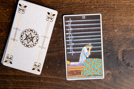 London, UK: 4 January, 2024: Minor Arcana - Nine of Swords of Tarot Card of Rider Waite deck on...