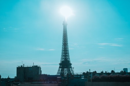 Eiffel tower in Paris, France during sunrise with Sun on its topの写真素材