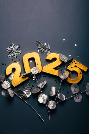 Happy New Year 2025. Golden digits 2025 with glitter on grey background. Holiday Party Decoration or...