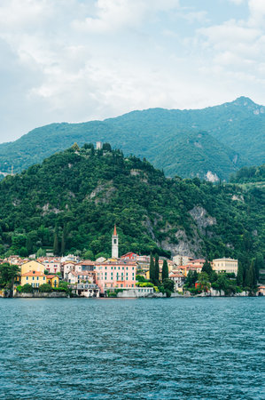Beautiful Varenna waterfront on a sunny summer afternoon shoot from the water, Lake Como, Lombardy, Italyの写真素材
