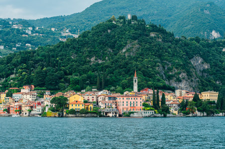 Beautiful Varenna waterfront on a sunny summer afternoon shoot from the water, Lake Como, Lombardy, Italyの写真素材