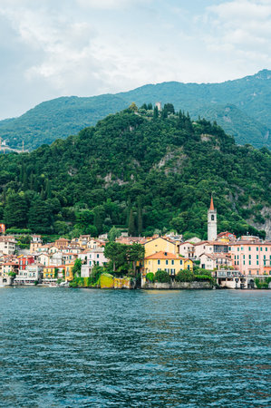 Beautiful Varenna waterfront on a sunny summer afternoon shoot from the water, Lake Como, Lombardy, Italyの写真素材