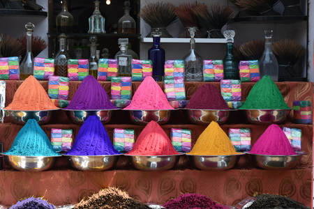 colorful powders and scented sticks arranged in patterns in the streets for the fetivalの写真素材