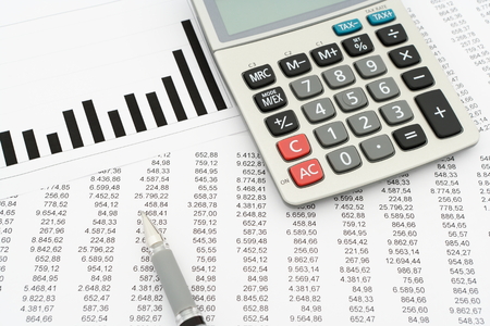 calculator, pen, documents with numbers and diagramの写真素材